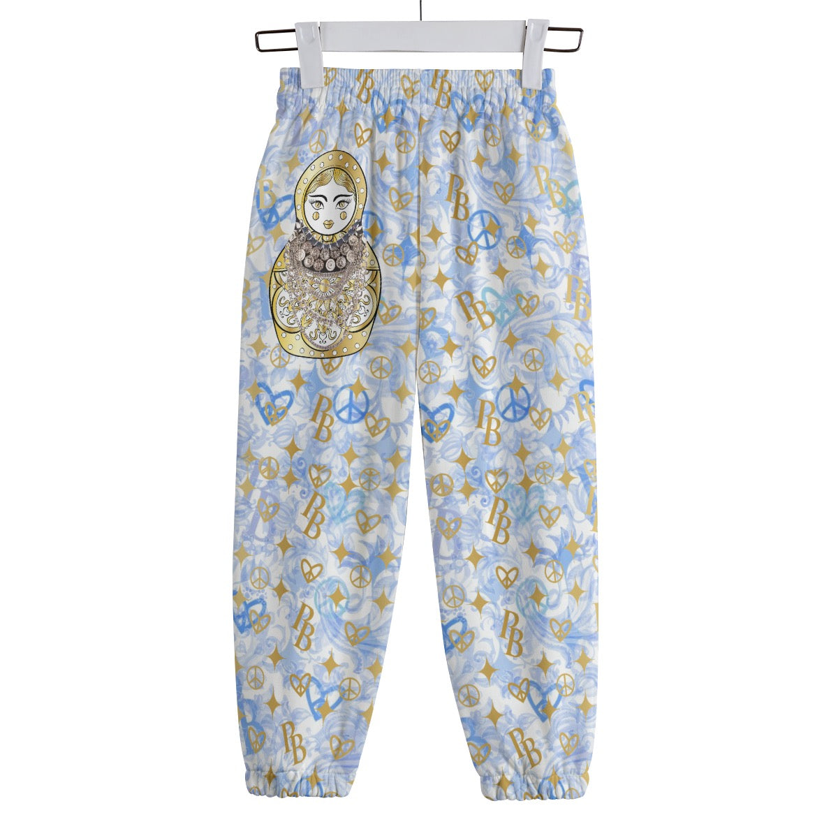 Stylische Kinderhose von PIA BOLTE® – Delft Dreams mit Peace-Symbolen & Matroschka-Detail